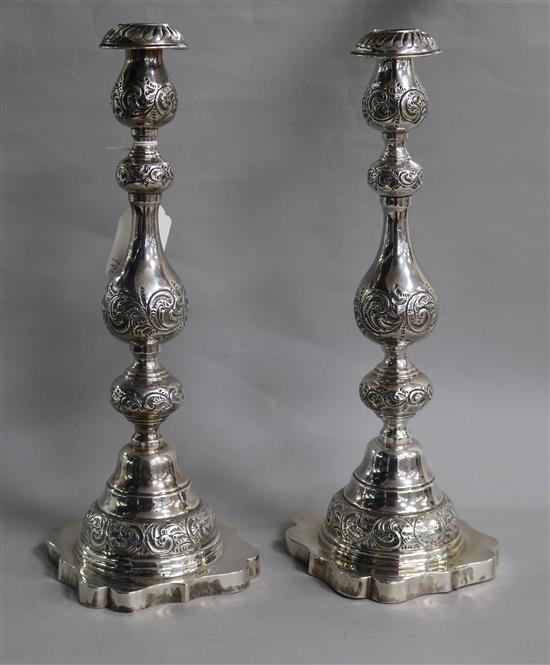 A pair of George V silver sabbath day candlesticks, by Sigmund Zyto, London, 1923, weighted.